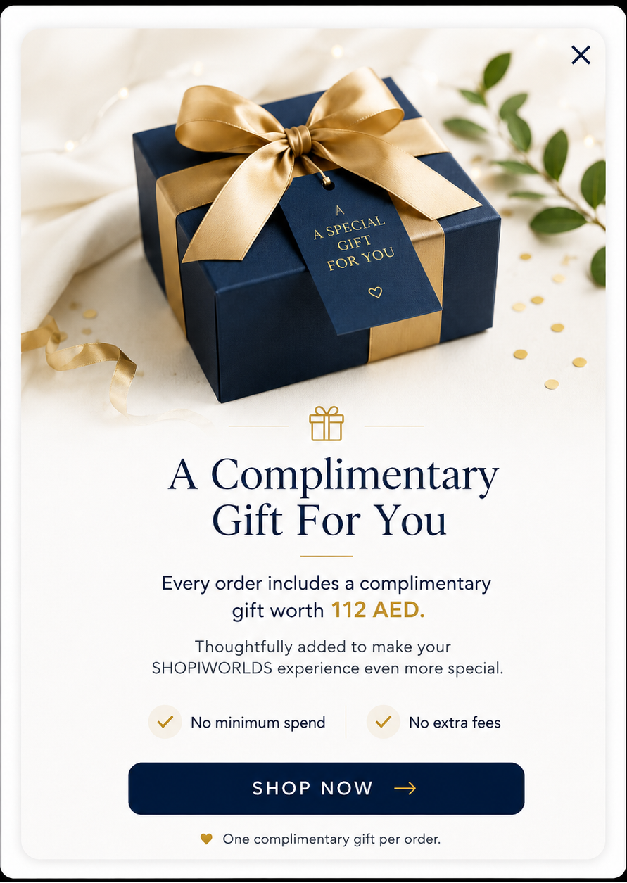 A promotional graphic for ShopWorlds showing a navy blue gift box tied with a gold ribbon and tag that reads &