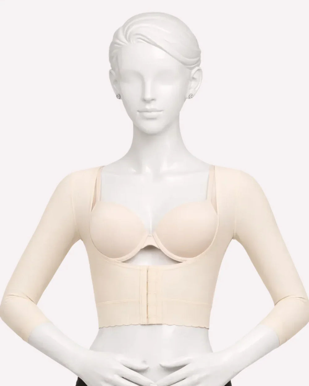 Beige long-sleeve compression bra with front closure on mannequin, ISAVELA USA model
